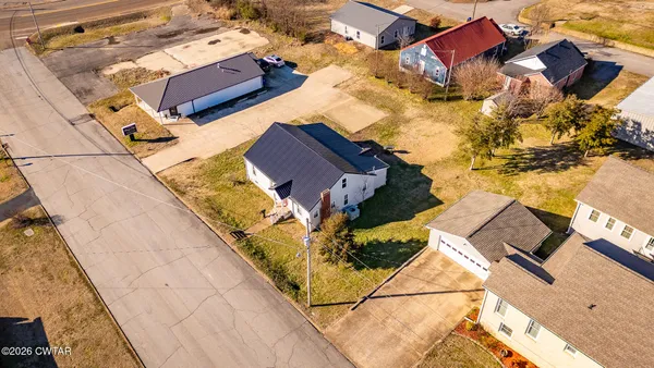 an aerial view of a house with swimming pool