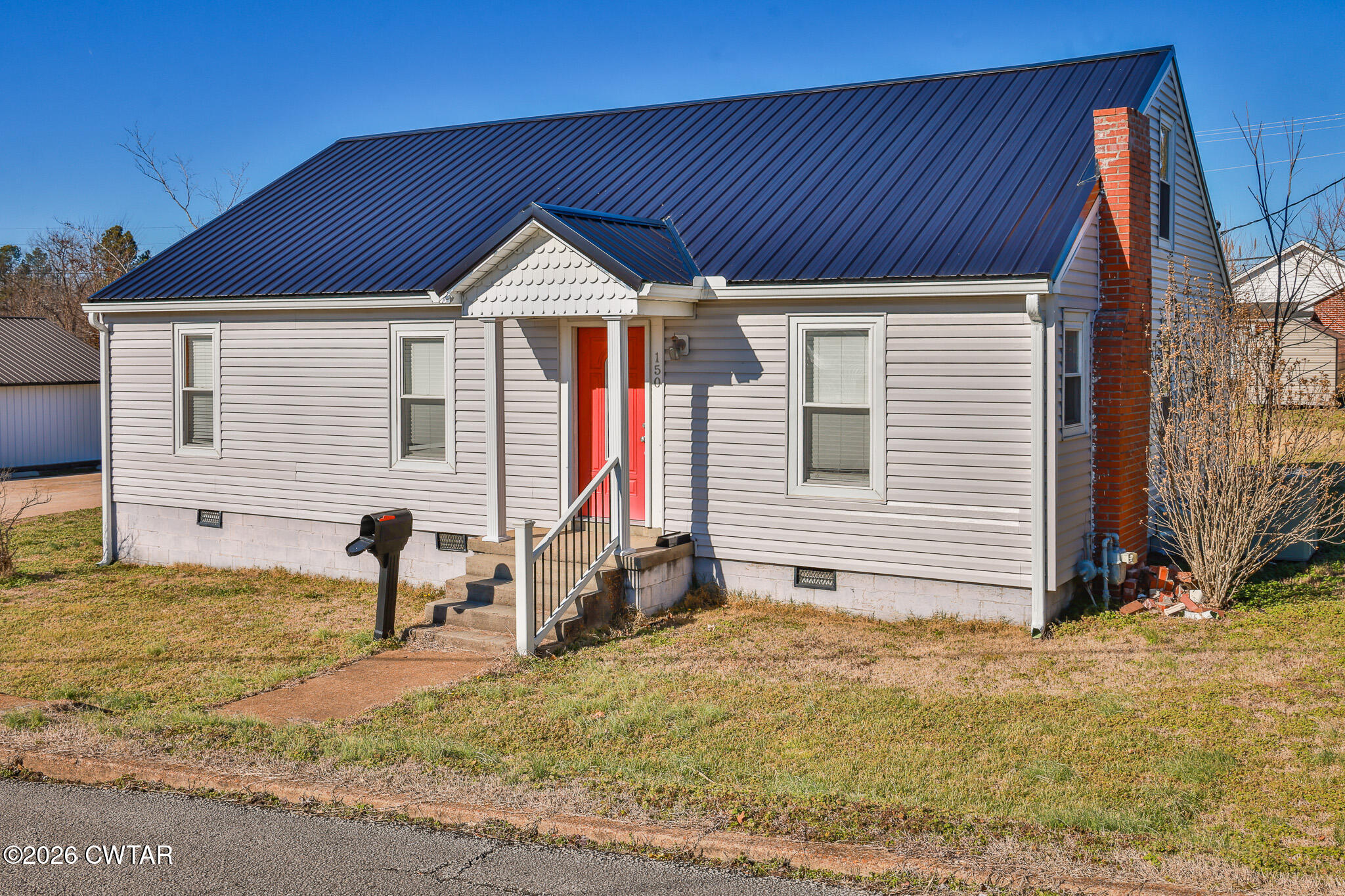 150 West Locust Street Dresden, TN 38225 - Photo 5 of 31 a view of a house with backyard and sitting area