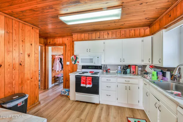 a kitchen with stainless steel appliances a stove and cabinets