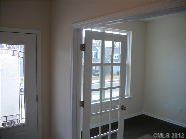 1204 Screech Owl Road Waxhaw, NC 28173 - Photo 2 of 16 a view of wooden floor and windows in a room