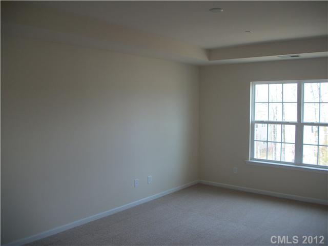 1204 Screech Owl Road Waxhaw, NC 28173 - Photo 7 of 16 an empty room with a window