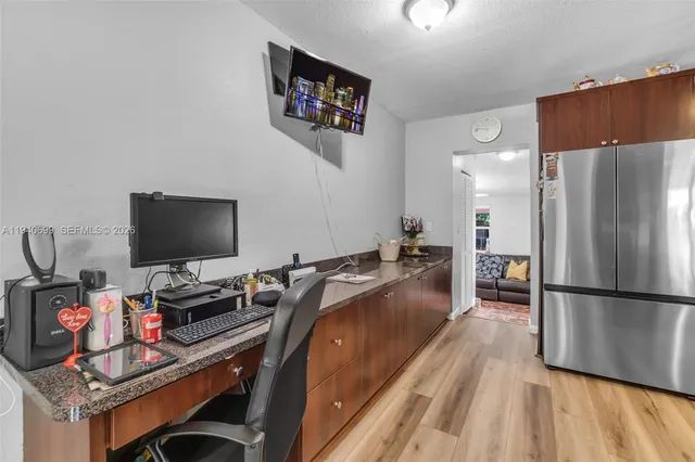 a bed room with a bed and a television