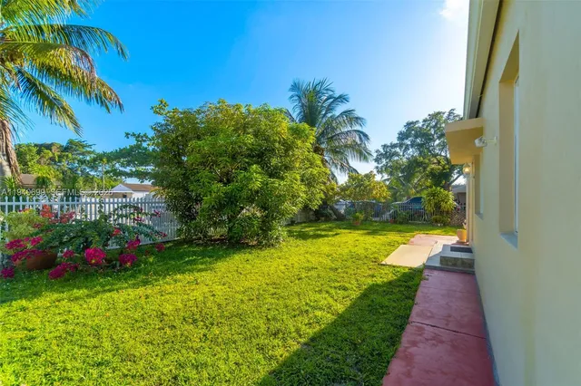 a backyard of a house with lots of green space
