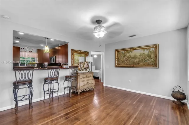a view of a livingroom with furniture and wooden floor