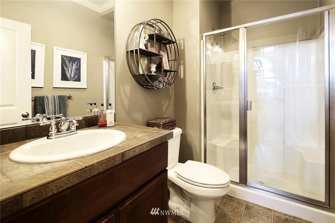 3220 217th Place Southeast Bothell, WA 98021 - Photo 14 of 27 a bathroom with a granite countertop sink toilet and shower