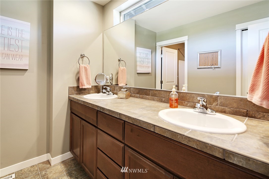 3220 217th Place Southeast Bothell, WA 98021 - Photo 22 of 27 a bathroom with a sink and a mirror