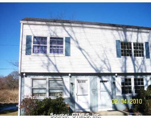 25 Riverside Drive, Unit B8 Clinton, CT 06413 - Photo 1 of 1 a front view of a building with large windows