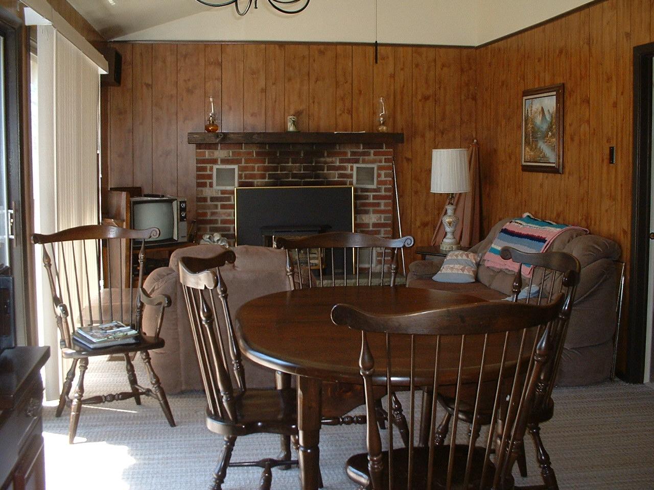 65 Buck Hill Road Blakeslee, PA 18610 - Photo 6 of 16 a dining room with furniture a fireplace and wooden floor