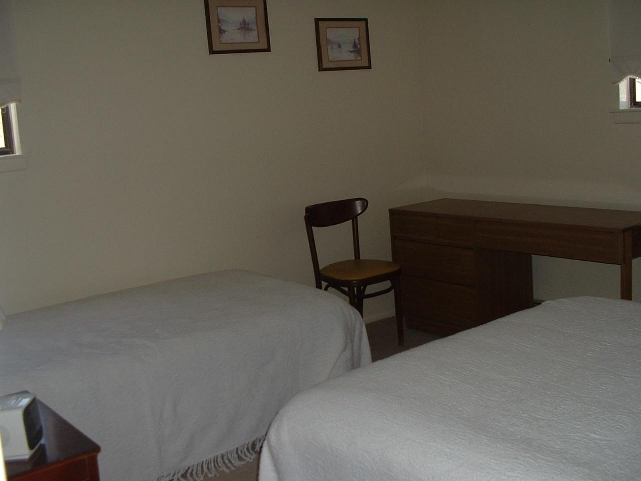 65 Buck Hill Road Blakeslee, PA 18610 - Photo 9 of 16 a bedroom with a bed and a chair