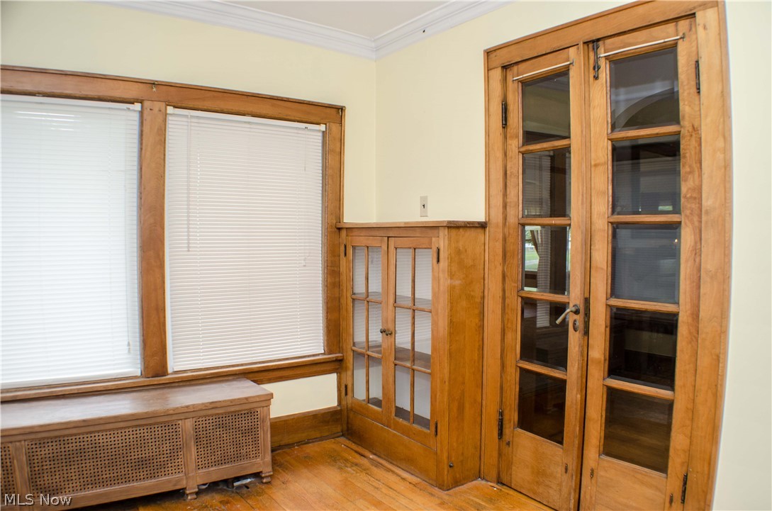 1123 Berwin Street Akron, OH 44310 - Photo 17 of 34 Sunny Solarium with built-in bookcase, beveled glass French doors and hardwood floors