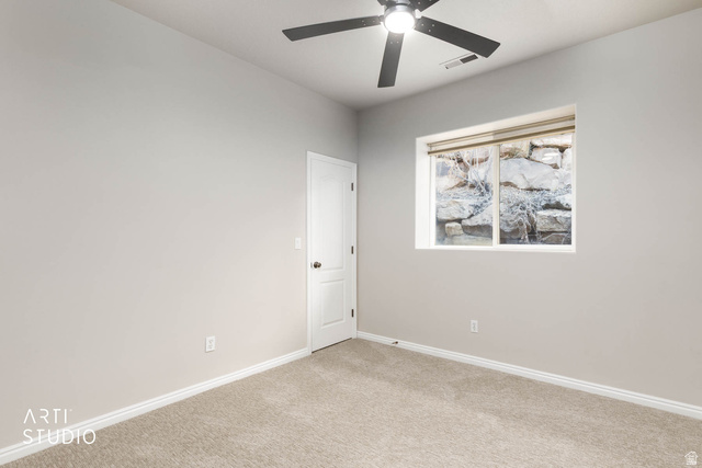2158 Balboa Way St. George, UT 84770 - Photo 28 of 40 Carpeted spare room with baseboards and a ceiling fan