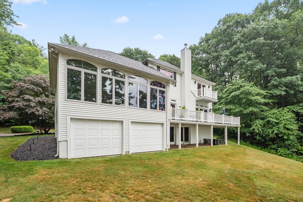 14 Demond Pond Row Rutland, MA 01543 - Photo 39 of 42 a front view of a house with a garden