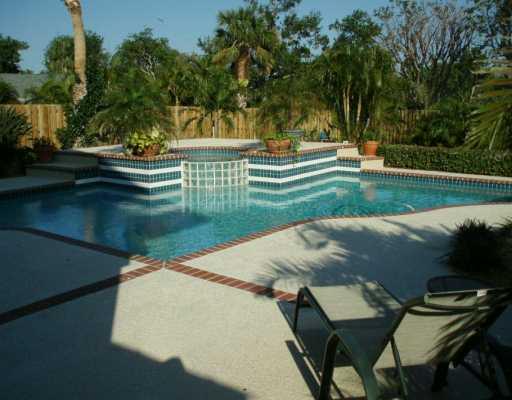 48 Rio Vista Drive Stuart, FL 34996 - Photo 3 of 8 a view of a lake with a yard