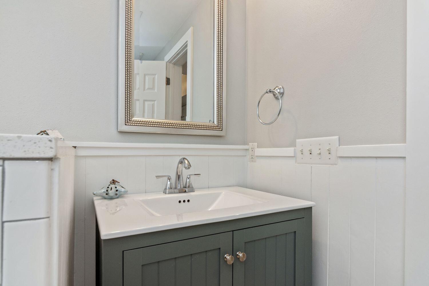 95 Laura Hamilton Boulevard, Unit 209 Santa Rosa Beach, FL 32459 - Photo 17 of 37 a bathroom with a sink and a mirror