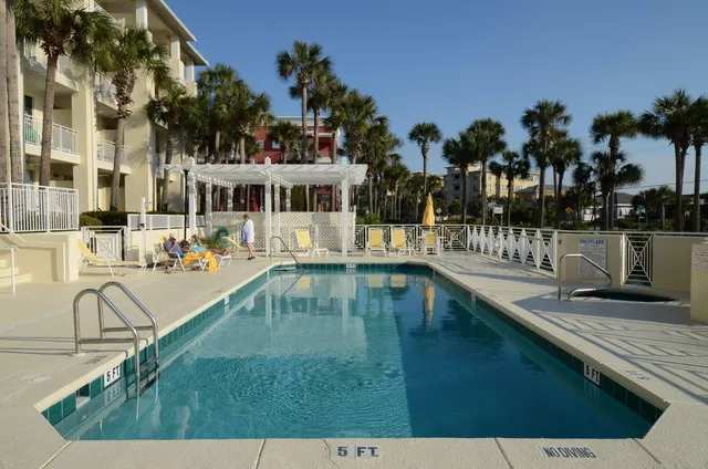 a view of swimming pool with outdoor seating and plants