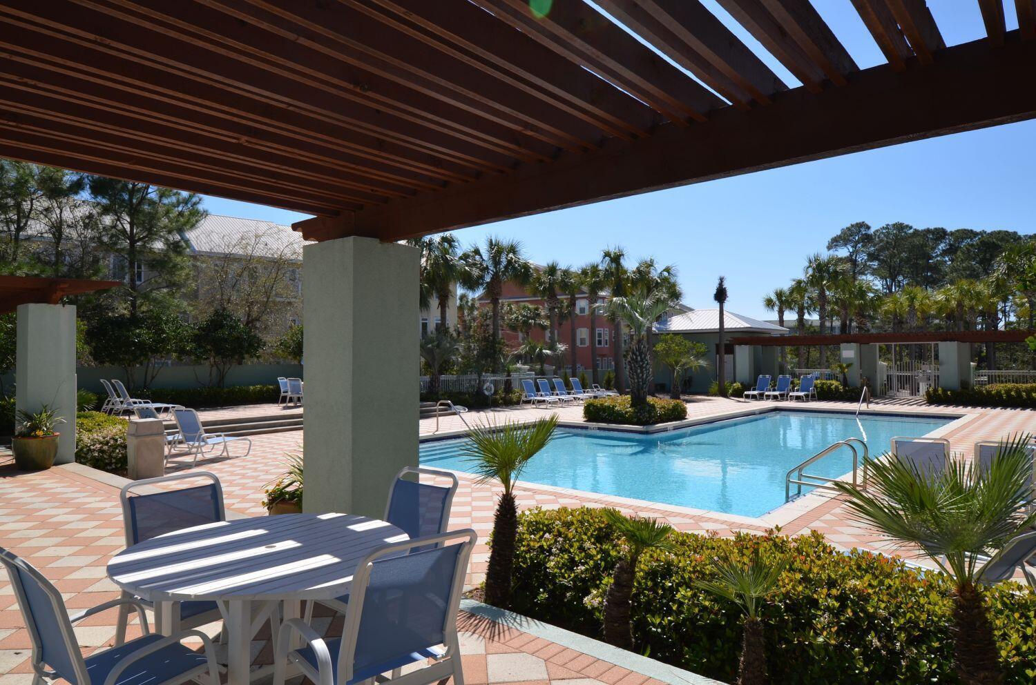 95 Laura Hamilton Boulevard, Unit 209 Santa Rosa Beach, FL 32459 - Photo 26 of 37 a view of swimming pool with outdoor seating and plants