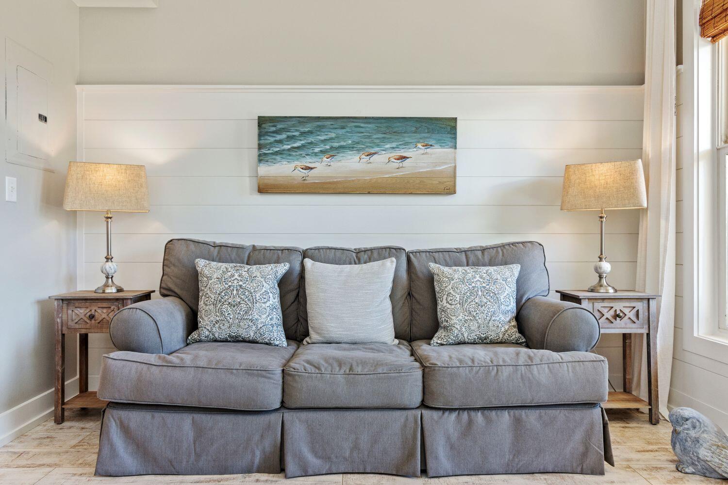 95 Laura Hamilton Boulevard, Unit 209 Santa Rosa Beach, FL 32459 - Photo 6 of 37 a living room with furniture and a lamp