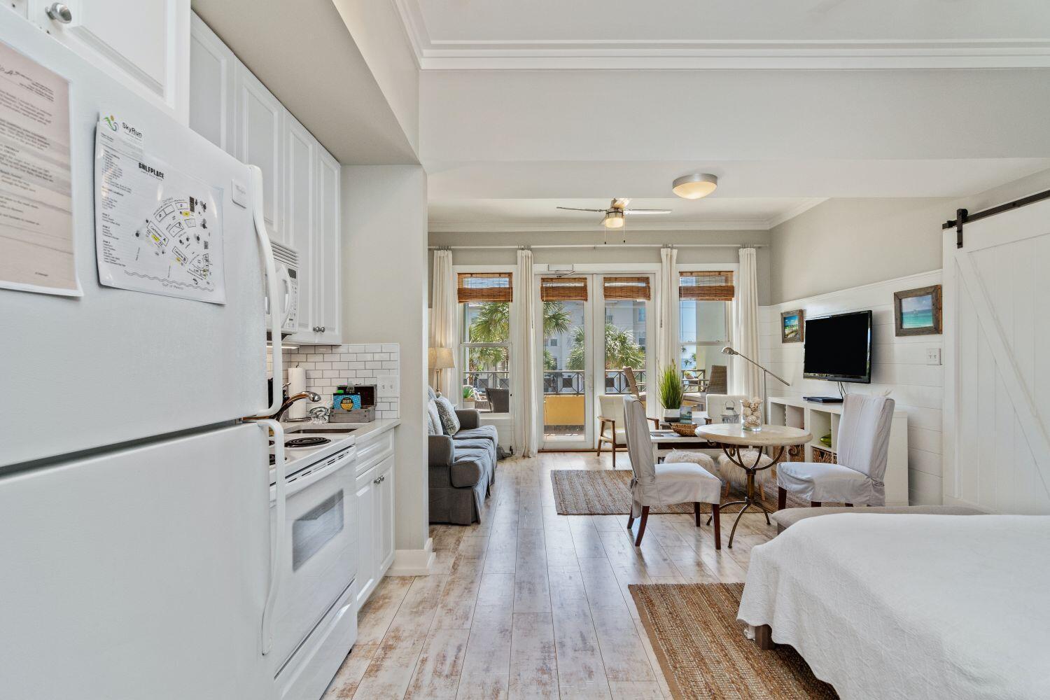 95 Laura Hamilton Boulevard, Unit 209 Santa Rosa Beach, FL 32459 - Photo 9 of 37 a living room with furniture and a flat screen tv