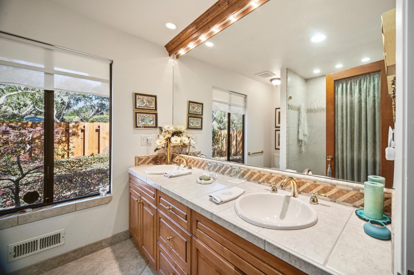 2911 Colton Road Pebble Beach, CA 93953 - Photo 31 of 46 a bathroom with a sink double vanity and a mirror