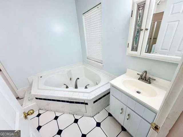 a bathroom with a sink and a bathtub