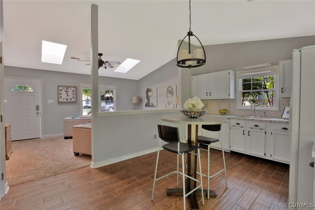 6406 Oldbern Road Chesterfield, VA 23832 - Photo 8 of 18 a kitchen with white cabinets and wooden floor