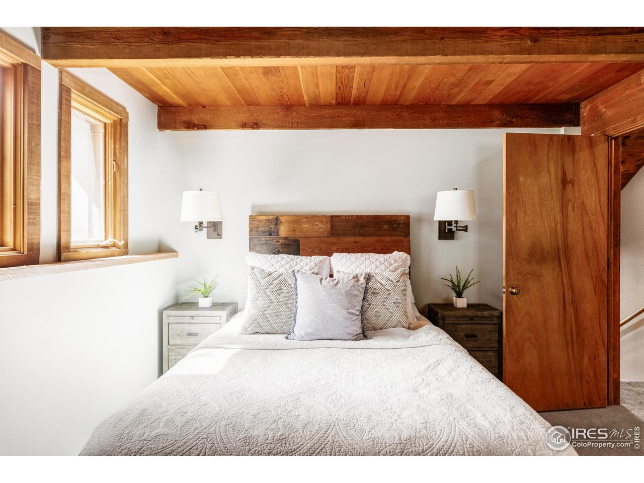 279 Forrest Lane Boulder, CO 80302 - Photo 16 of 36 a bedroom with a bed and window