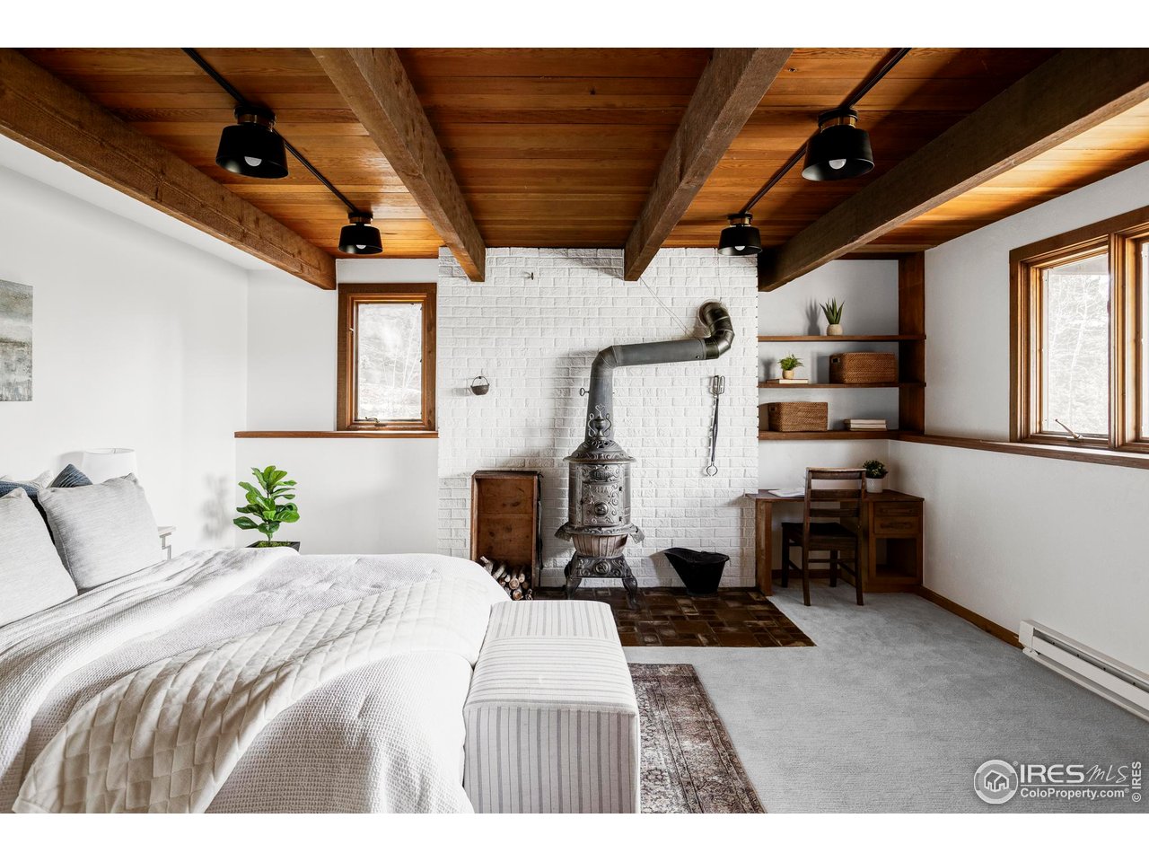 279 Forrest Lane Boulder, CO 80302 - Photo 20 of 36 a bedroom with furniture and a large window