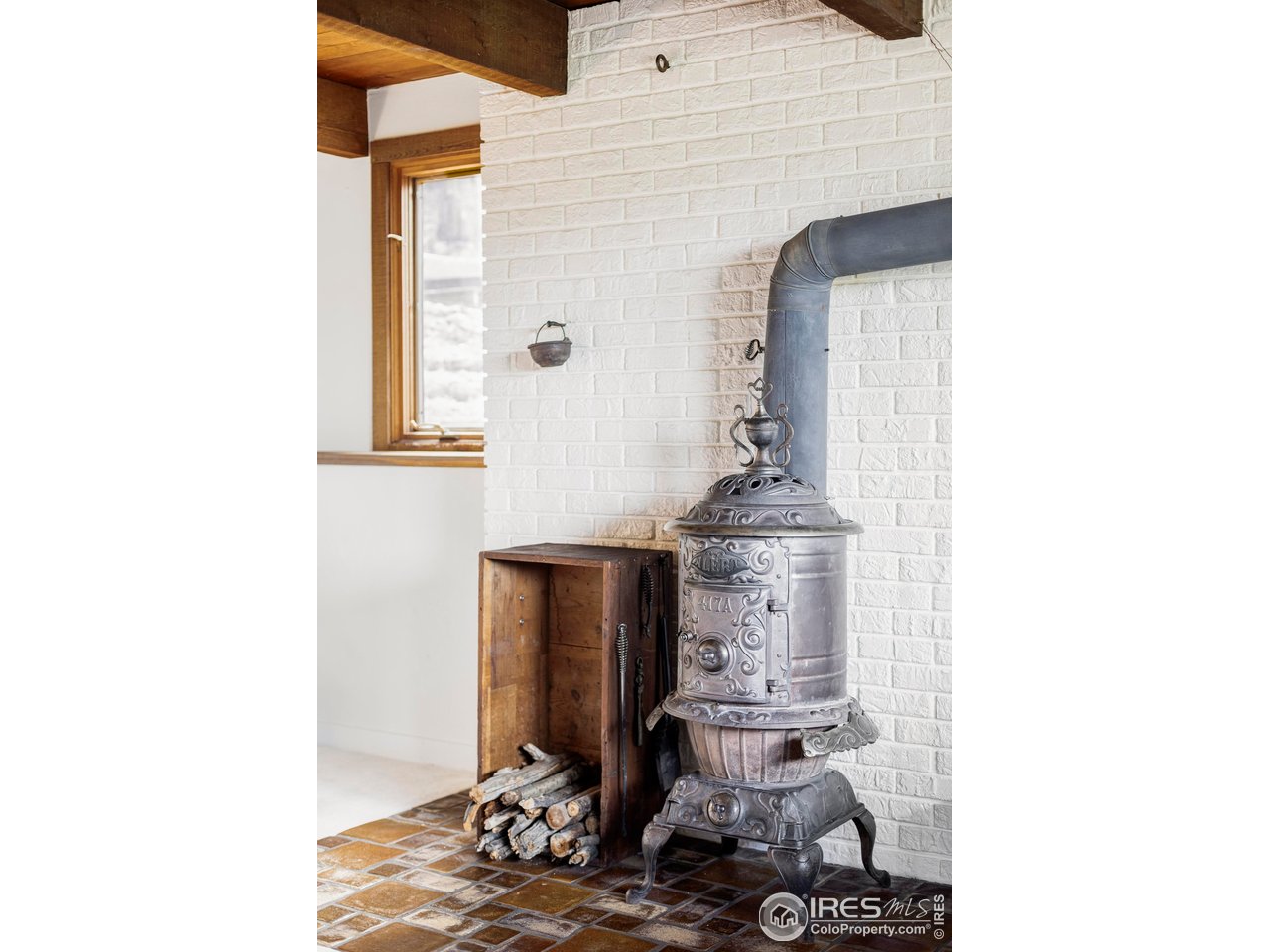 279 Forrest Lane Boulder, CO 80302 - Photo 21 of 36 a living room with furniture and a fireplace