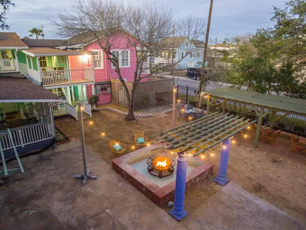 an aerial view of a dinning tables and chairs in a patio