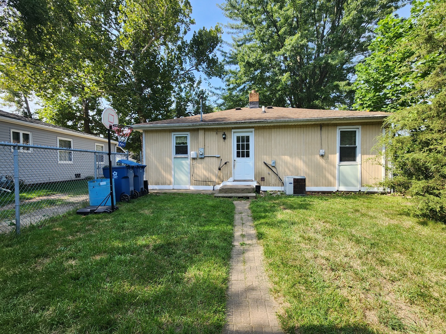 1354 Circle Drive Kankakee, IL 60901 - Photo 12 of 14 a view of a house with backyard sitting area and garden