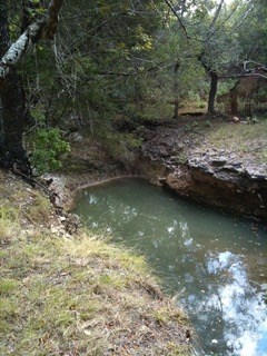 108 Oak Road Fredericksburg, TX 78624 - Photo 10 of 14 a view of a lake from a yard