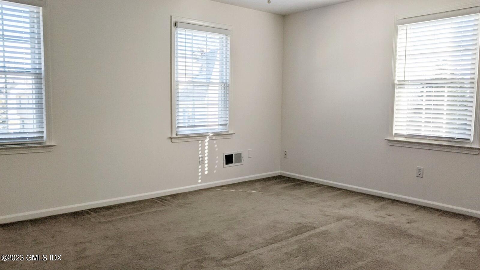 66 Ute Place, Unit A Greenwich, CT 06830 - Photo 11 of 18 an empty room with a window