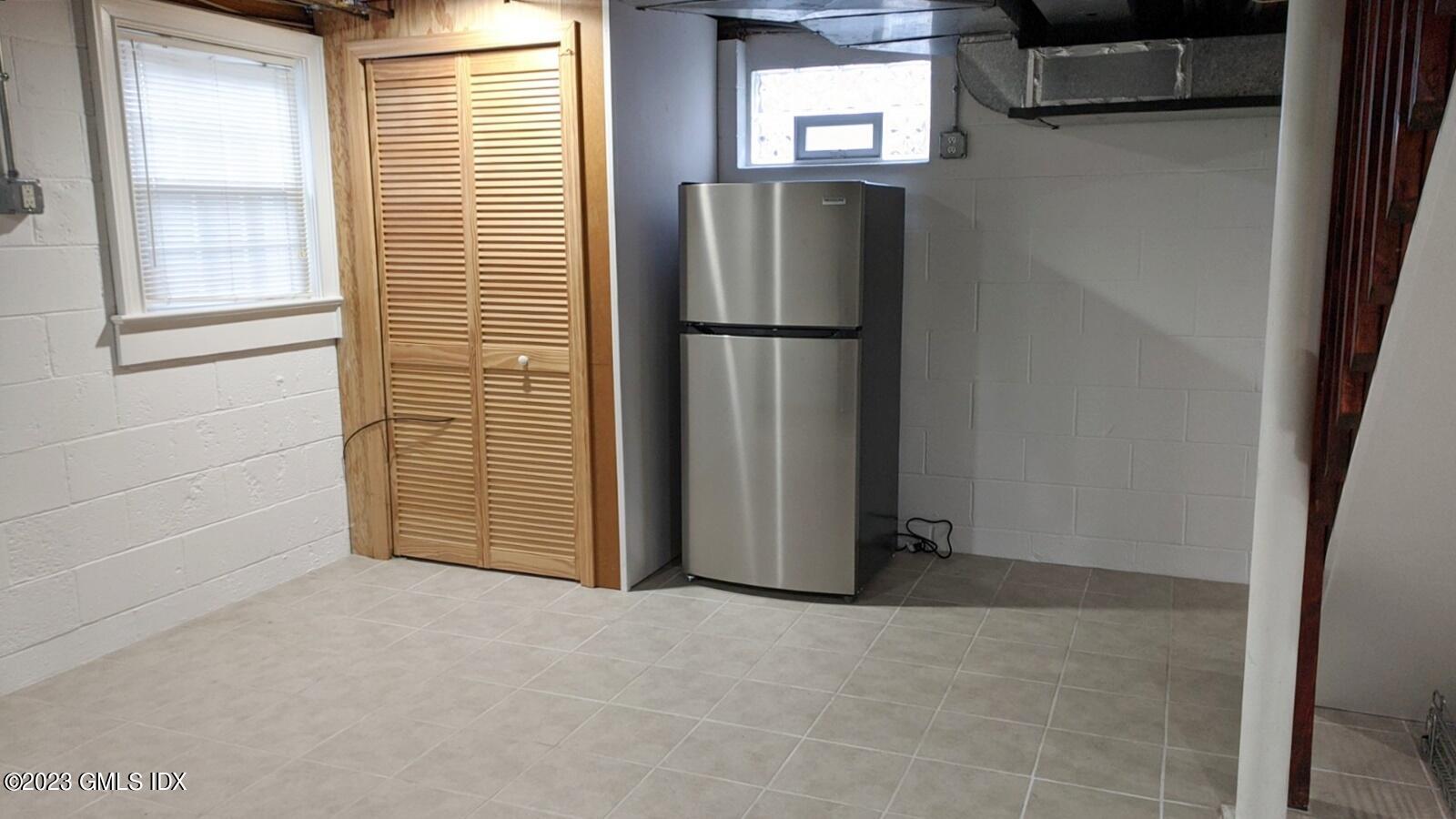 66 Ute Place, Unit A Greenwich, CT 06830 - Photo 17 of 18 a view of empty room with windows and wardrobe