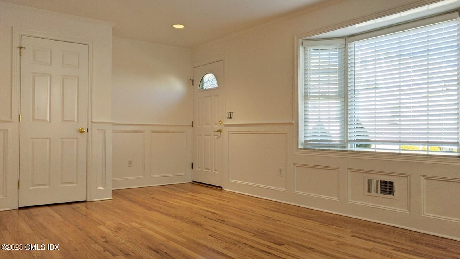 66 Ute Place, Unit A Greenwich, CT 06830 - Photo 2 of 18 a view of empty room with wooden floor and fan
