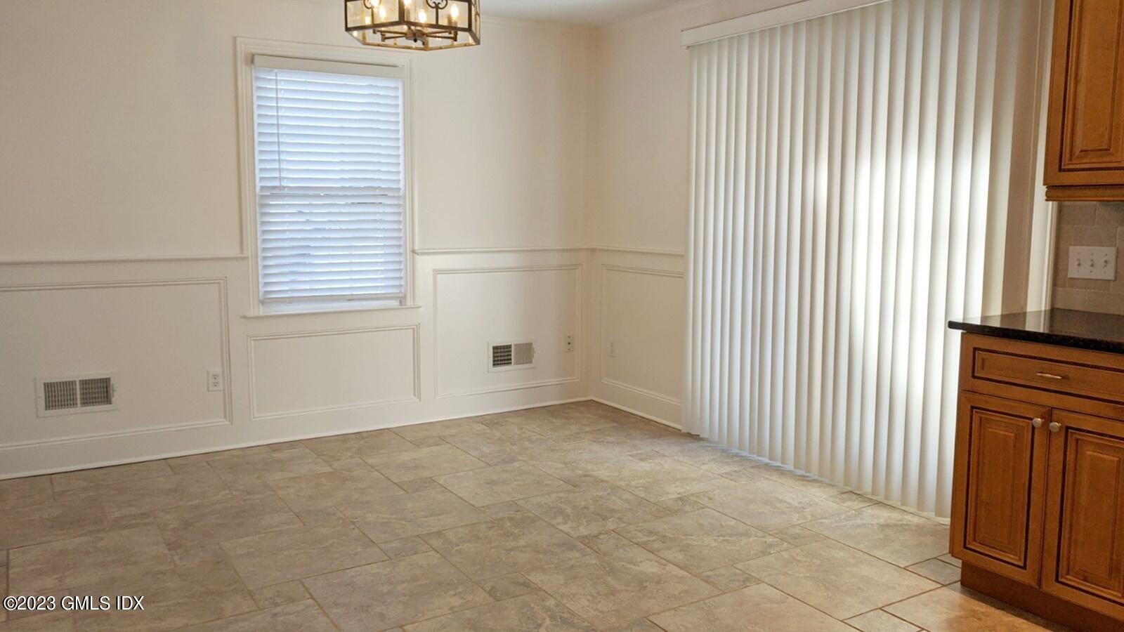 66 Ute Place, Unit A Greenwich, CT 06830 - Photo 4 of 18 an empty room with windows