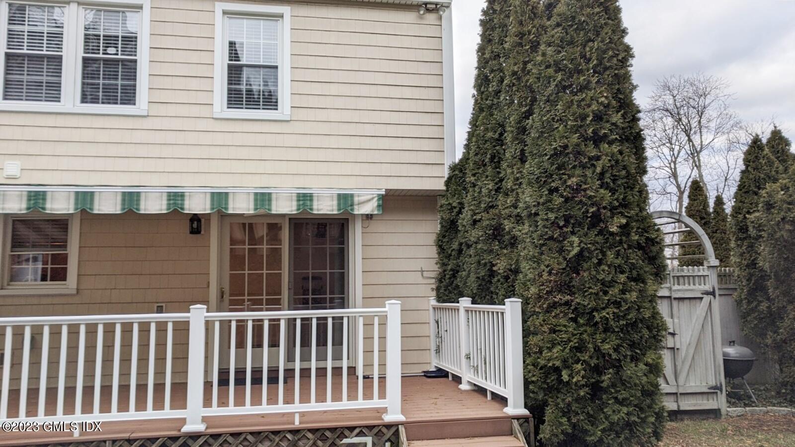 66 Ute Place, Unit A Greenwich, CT 06830 - Photo 7 of 18 a view of a house with a yard