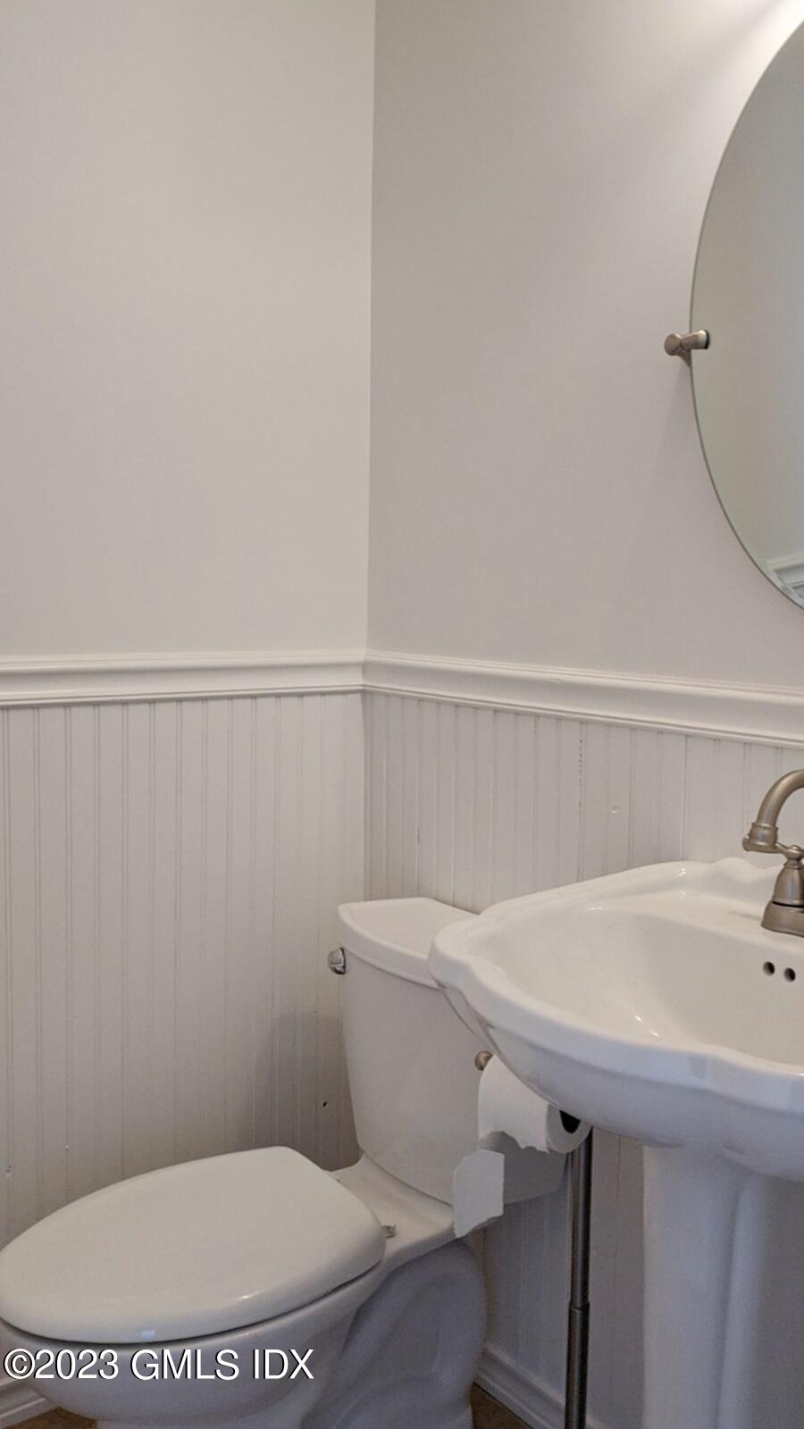 66 Ute Place, Unit A Greenwich, CT 06830 - Photo 10 of 18 a bathroom with a sink a toilet and a mirror
