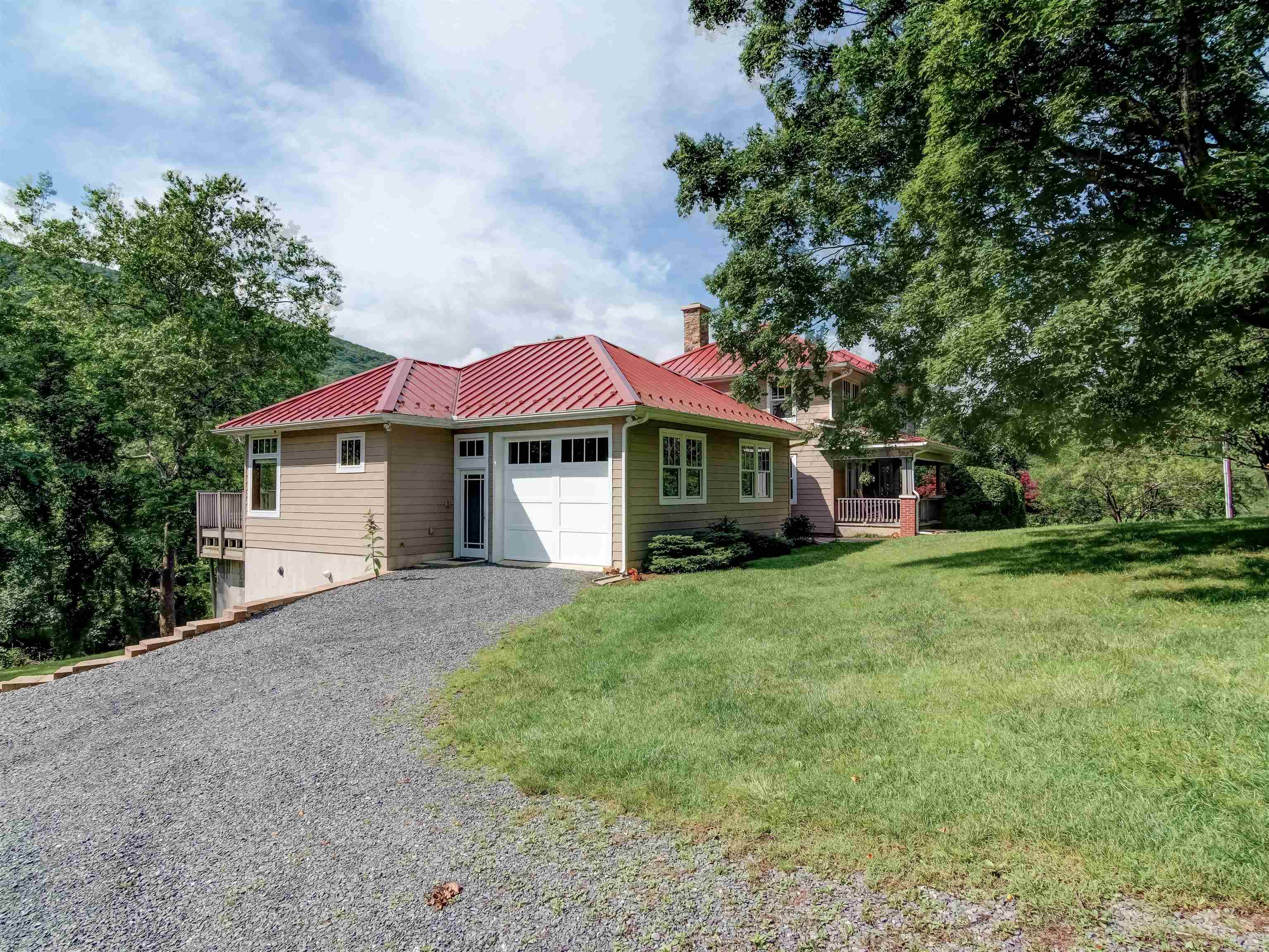 7304 Dry Run Road Williamsville, VA 24487 - Photo 9 of 57 a front view of a house with a yard and trees