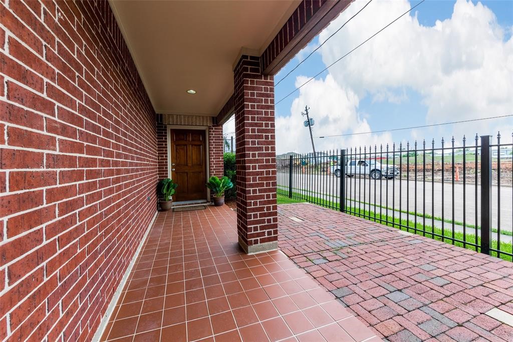 3027 Buttercup Street Houston, TX 77063 - Photo 14 of 29 a view of a pathway with a brick house in front of door