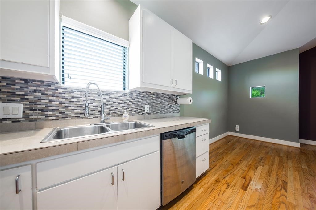 3027 Buttercup Street Houston, TX 77063 - Photo 6 of 29 a kitchen with a sink and cabinets