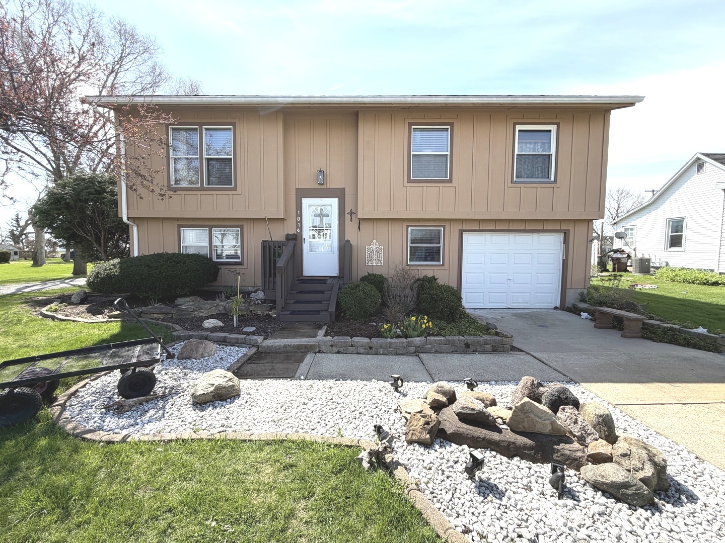 a front view of a house with garden