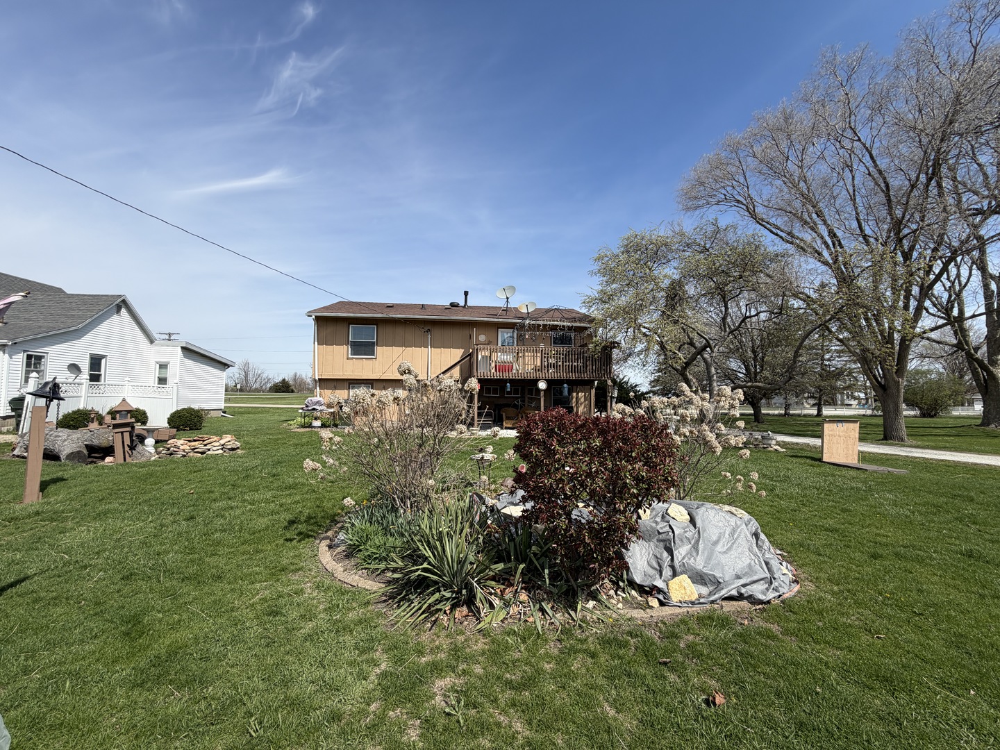 101 1/2 East North Street Danforth, IL 60930 - Photo 9 of 14 a view of a house with a yard and sitting area