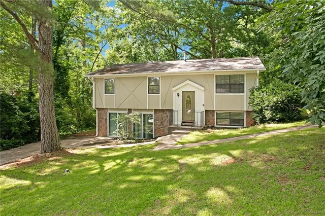 a front view of a house with a yard