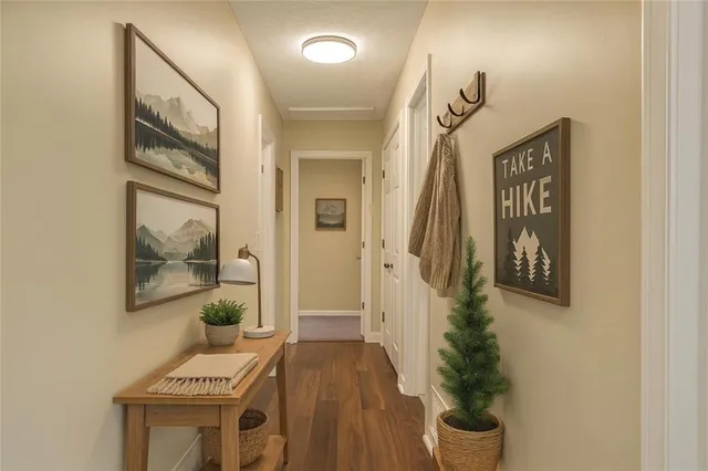 a view of front door with wooden floor
