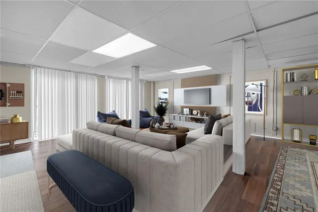 a living room with furniture or couch and a wooden floor