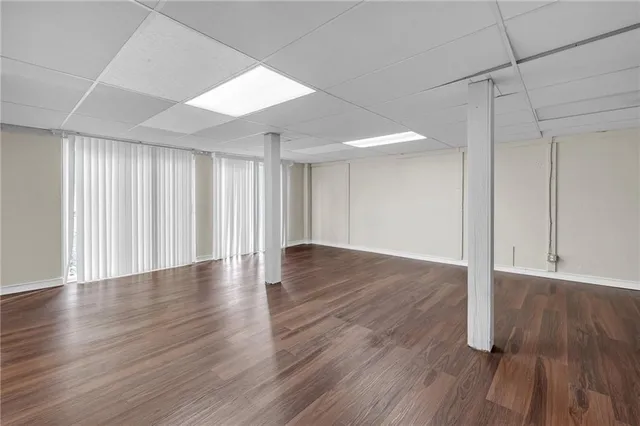 a view of a room with wooden floor