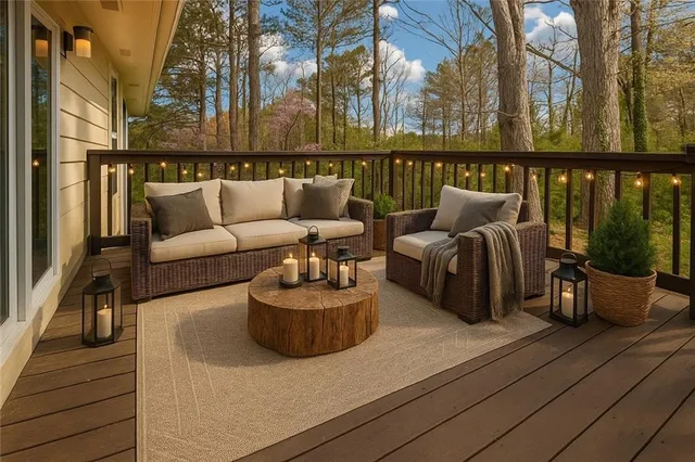 a balcony with furniture and wooden floor