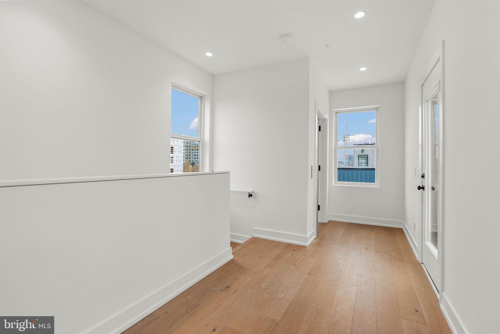 650 Fairmount Avenue, Unit A2 Philadelphia, PA 19123 - Photo 16 of 40 wooden floor in an empty room with a window