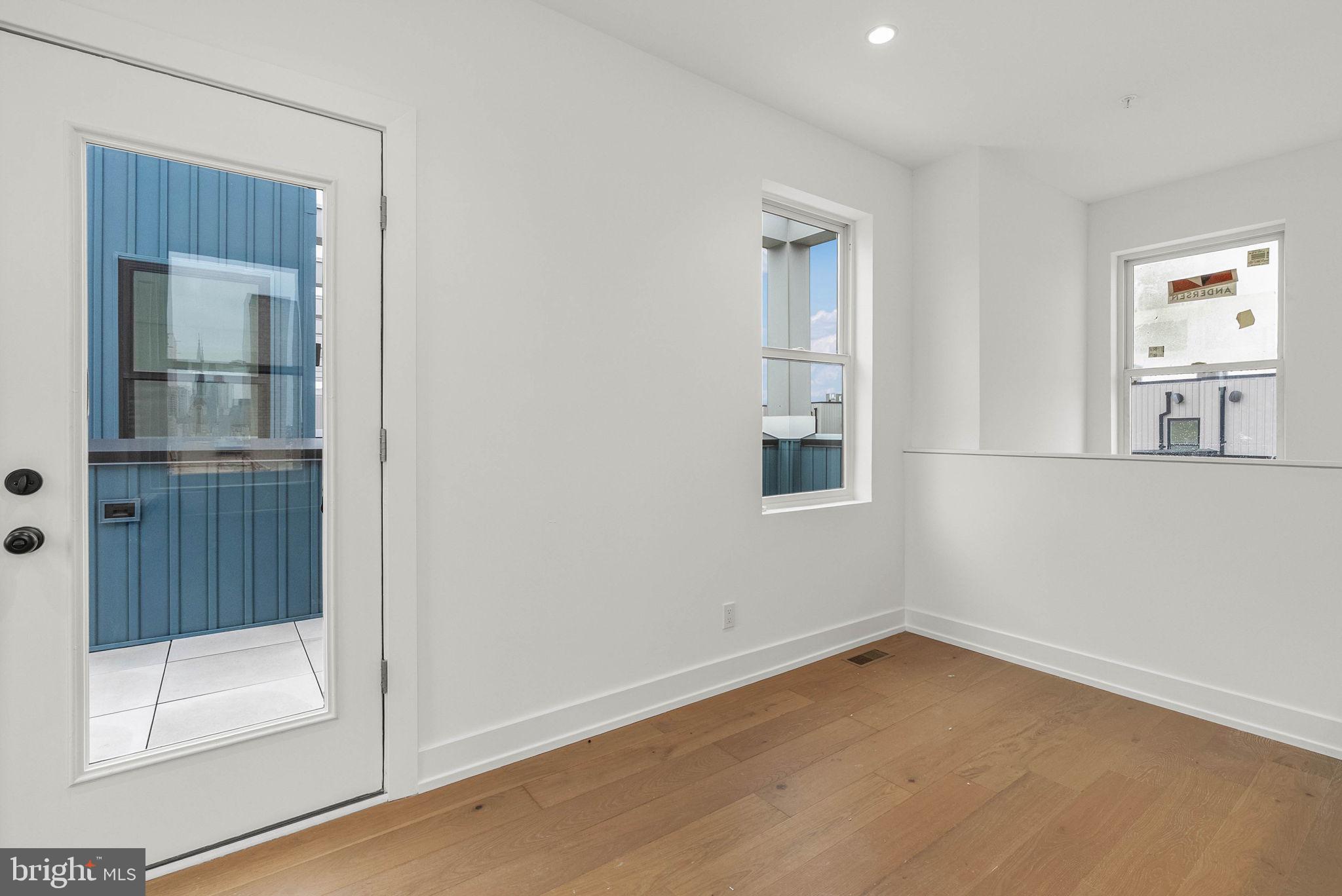 650 Fairmount Avenue, Unit A2 Philadelphia, PA 19123 - Photo 18 of 40 an empty room with windows and entrance