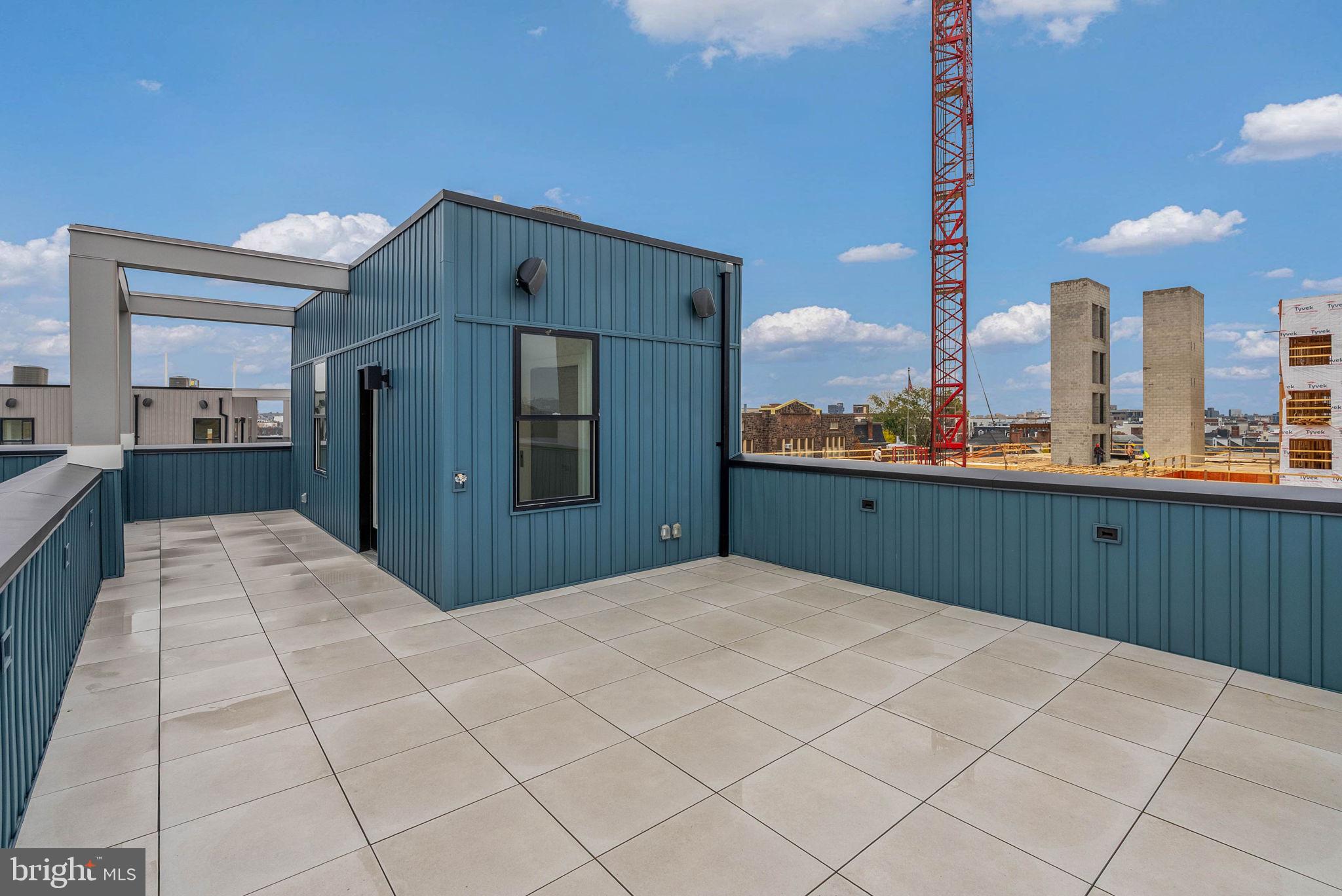 650 Fairmount Avenue, Unit A2 Philadelphia, PA 19123 - Photo 20 of 40 a kitchen with stainless steel appliances kitchen island granite countertop a refrigerator a sink and dishwasher